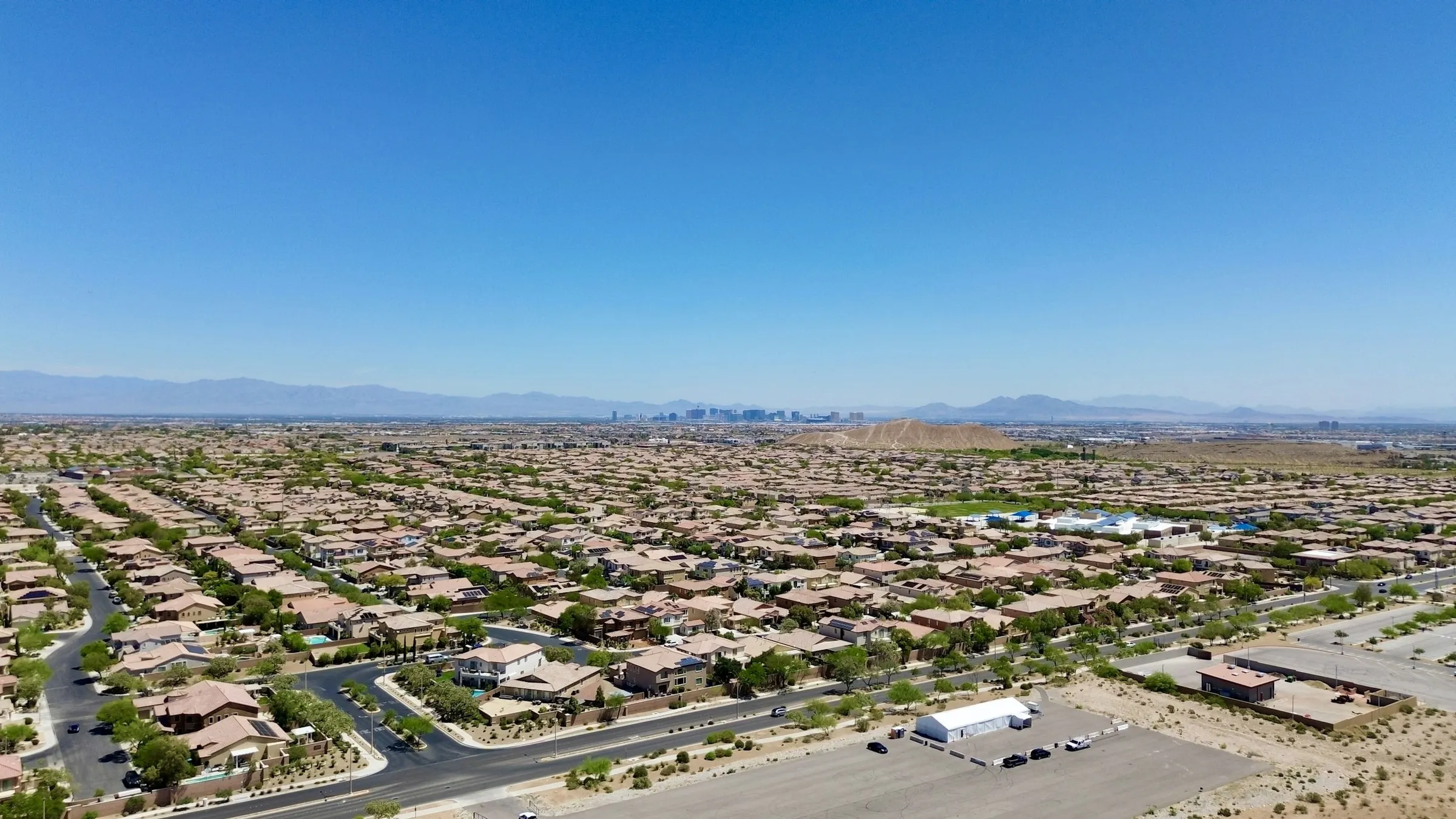 The Las Vegas valley from the air, homes stretching toward the mountains