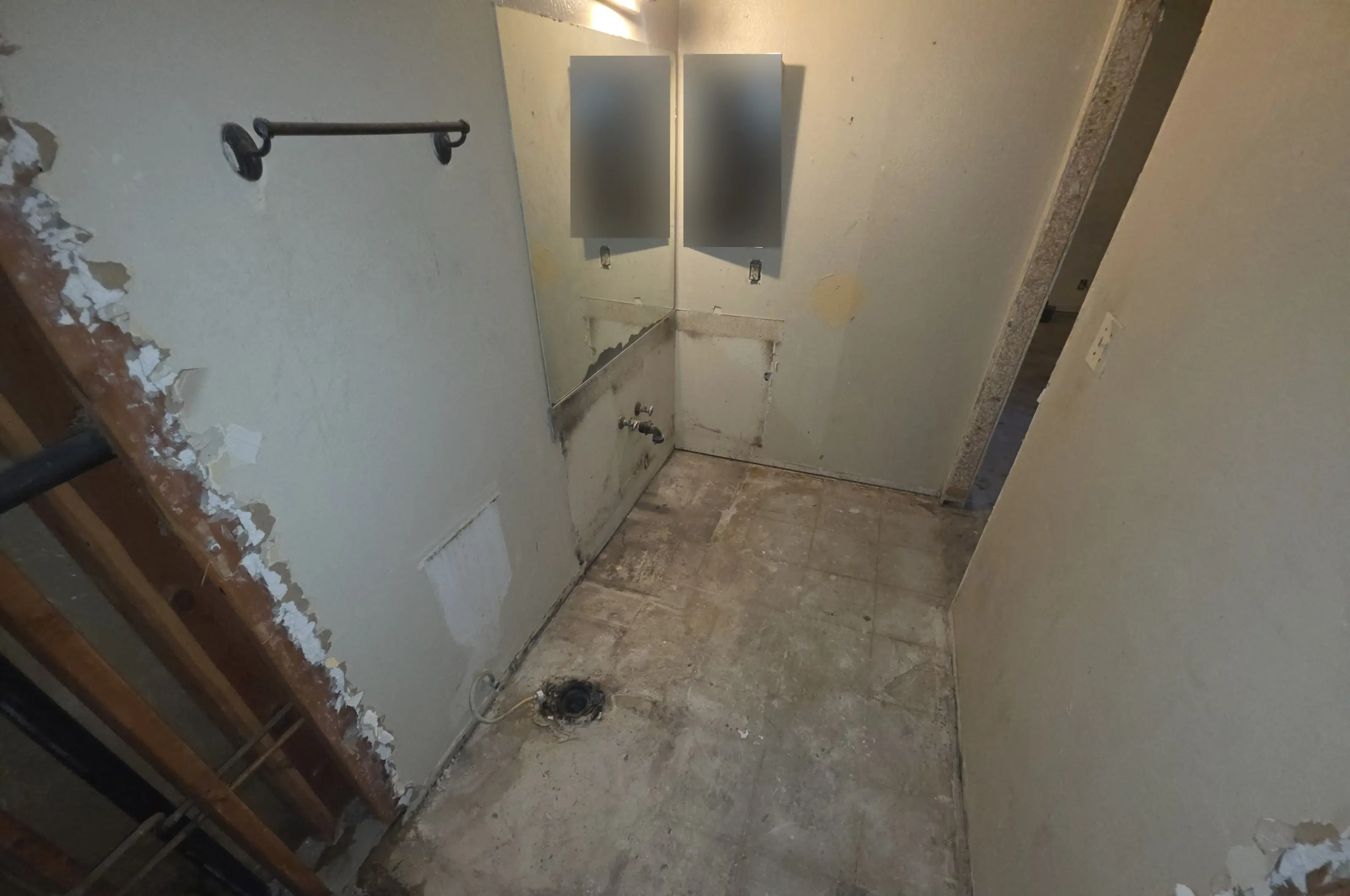 A bathroom gutted back to the framing and the floor
